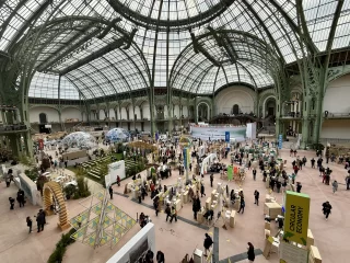 Inside the Grand Palais during ChangeNOW 2025, showcasing global sustainability solutions, circular economy exhibits, innovation domes and participants exploring climate and clean energy initiatives.